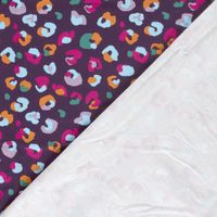 French Terry Stoff Leomuster aubergine pink orange Umgeschlagene Ecke zeigt die helle Innenseite mit Schlingenstruktur des French Terry Stoffs