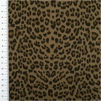 Ausschnitt eines Stretch Jeansstoffs mit schwarzem und braunem Leopardenmuster, Maßband am Bildrand