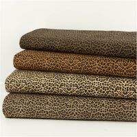 Jeansstoff Stretch Leo Leomuster cognac schwarz 1,5m Breite Vier Rollen Stretch-Jeansstoff mit Leopardenprint in unterschiedlichen Cognactönen im Stapel