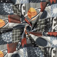 Popeline mit Weltraum-Patchwork in Grau und Orange, in der Mitte zu einer Spirale gedreht