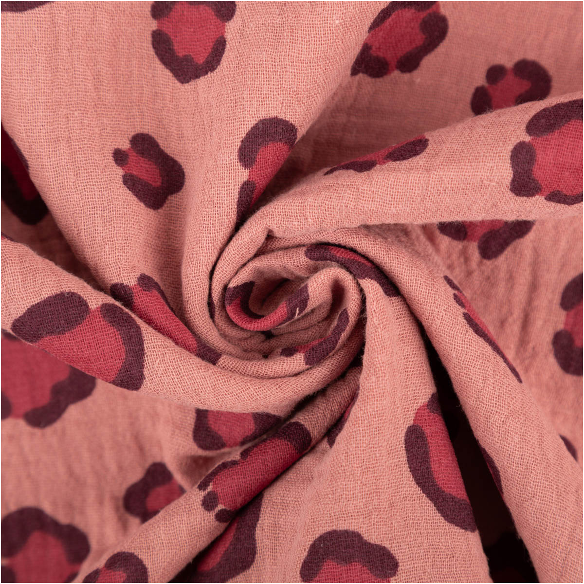 Musselin-Baumwollstoff mit Leomuster und Herzen in Mauve und Bordeaux zur Spirale gedreht
