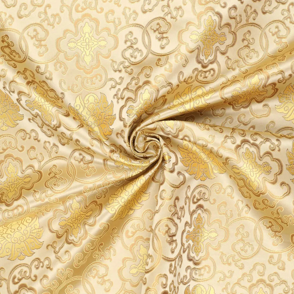 Brokat Jacquardstoff creme gold drapiert – edler Glanz des eingewebten Musters Brokat Jacquardstoff creme gold drapiert – edler Glanz des eingewebten Musters