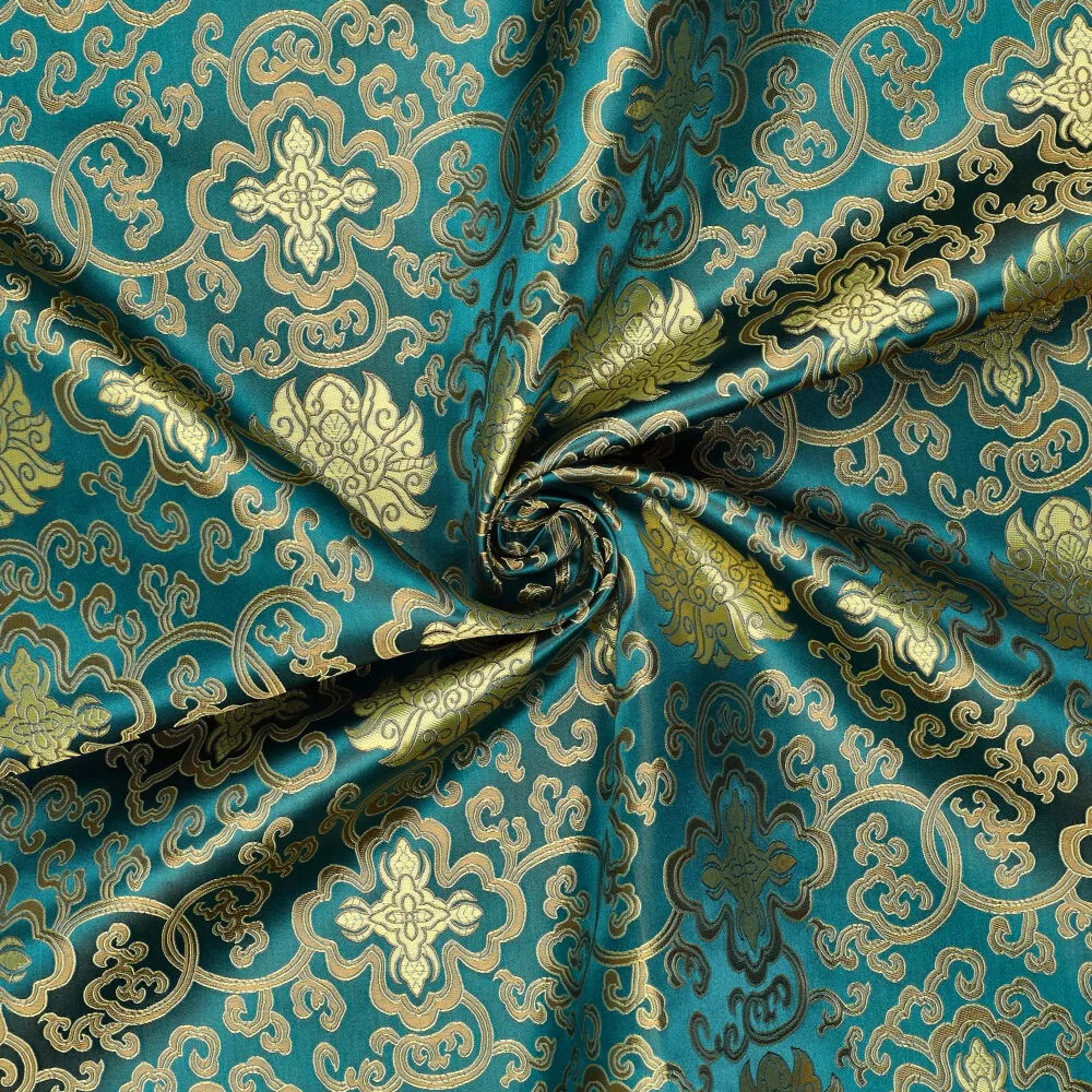 Brokat Jacquardstoff petrol gold drapiert – edler Glanz des eingewebten Musters Brokat Jacquardstoff petrol gold drapiert – edler Glanz des eingewebten Musters