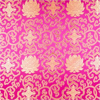Jacquardstoff Brokat Ornamente pink gold 1,50m Breite Nahaufnahme von Brokatstoff mit goldfarbenen Ornamenten auf pinkfarbenem Jacquardmaterial