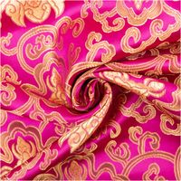Jacquardstoff Brokat Ornamente pink gold 1,50m Breite Brokat Jacquardstoff in Pink mit goldenen Ornamenten spiralförmig drapiert
