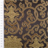 schwarzer Jacquardstoff mit goldfarbenen Ornamenten, Muster mit Maßband an der Seite abgebildet