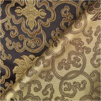 Jacquard-Brokat mit Ornamenten in Schwarz-Gold, Vorder- und Rückseite des Stoffes im Detail sichtbar