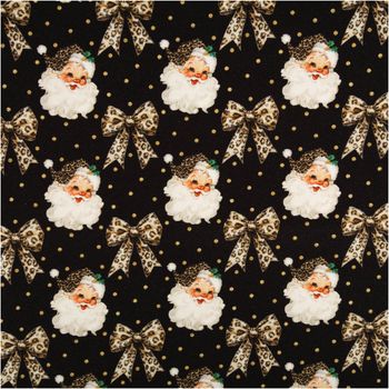 Sweat Weihnachtsstoff Weihnachtsmann Leo Schleifen schwarz beige 145cm Sweatstoff mit Weihnachtsmann und Leo-Schleifen auf schwarzem Grund, Nahaufnahme des Motivs