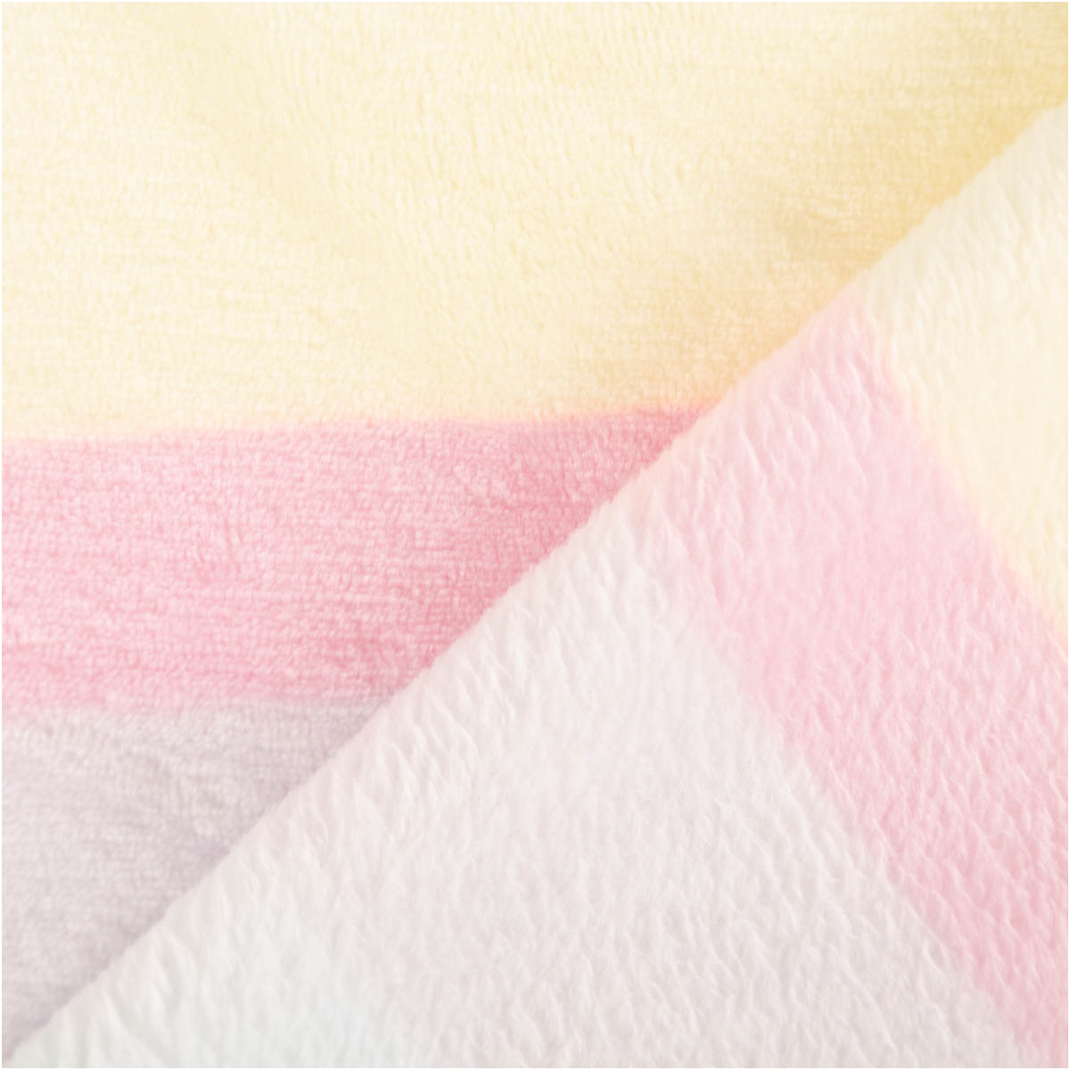 Fleece Stoff Farbverlauf pastell Polarfleece Digitaldruck 145cm Nahaufnahme von pastellfarbenem Fleece Stoff mit sichtbaren gelben und rosa Streifen, Vorder- und Rückseite sichtbar