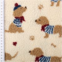 Teddystoff in Creme mit Dackel und blauen Streifen, weiche Struktur, Maßband am Rand