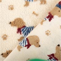 Teddystoff in Creme mit weicher Plüschstruktur, Vorder- und Rückseite mit Dackelmotiv in Braun und Blau