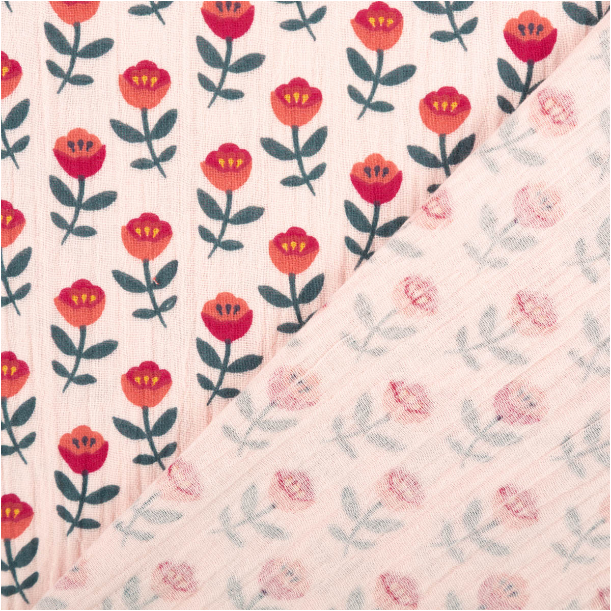 Musselin aus Baumwolle mit rosa Hintergrund, rote Blüten und grüne Blätter, Vorder- und Rückseite sichtbar