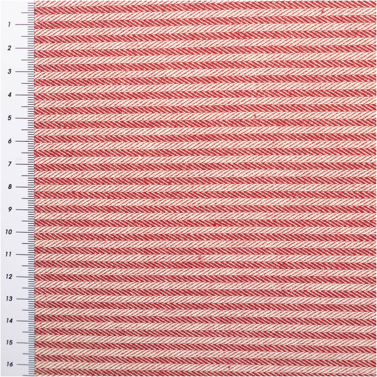 Dekostoff Dobby Streifen 3mm rot beige 1,40m Breite roter und beiger Dobby-Stoff mit feinem Streifenmuster, flach ausgebreitet und mit Maßband am Rand